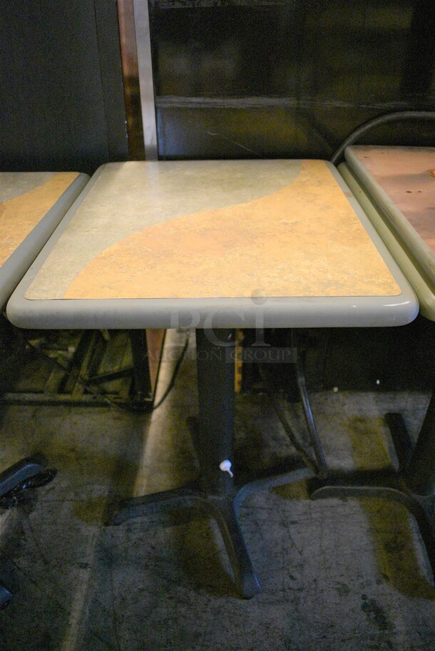 Tan and Green Table on Black Metal Table Base. Stock Picture - Cosmetic Condition May Vary. 20x24x30