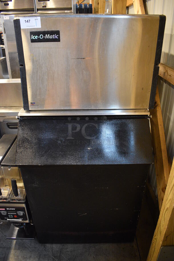 SWEET! Ice O Matic Model ICE0400FA2 Stainless Steel Commercial Air Cooled Ice Machine Head on Metal Commercial Ice Bin. 115 Volts, 1 Phase. 30x33x61