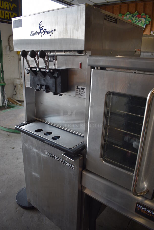 FANTASTIC! 2007 Electro Freeze Model 88T-RMT-137 Stainless Steel Commercial Floor Style Water Cooled 2 Flavor w/ Twist Soft Serve Ice Cream Machine on Commercial Casters. 208-230 Volts, 1 Phase. 24x33x68 - Image 3 of 11