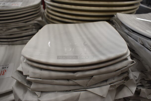 18 White Ceramic Plates. 7x7x1. 18 Times Your Bid!