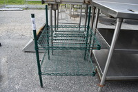 Green Finish 2 Tier Shelving Unit w/ 3 Poles. 24x24x33. BUYER MUST DISMANTLE. PCI CANNOT  DISMANTLE FOR SHIPPING. PLEASE CONSIDER FREIGHT CHARGES.