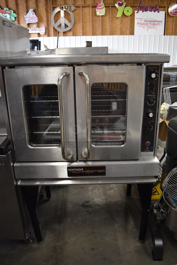 BEAUTIFUL! Montague Technostar Stainless Steel Commercial Gas Powered Full Size Convection Oven w/ View Through Doors, Metal Oven Racks and Thermostatic Controls on Metal Legs. 38x35x62