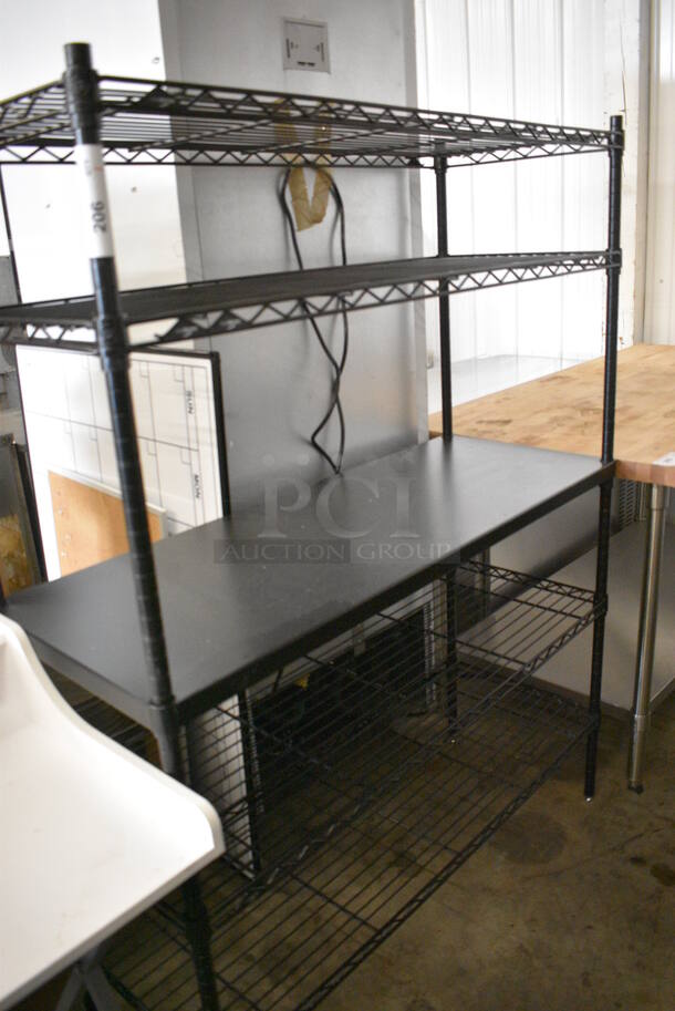 Black Finish 5 Finish Metro Style Shelving Unit. 48x18x63. BUYER MUST DISMANTLE. PCI CANNOT DISMANTLE FOR SHIPPING. PLEASE CONSIDER FREIGHT CHARGES.