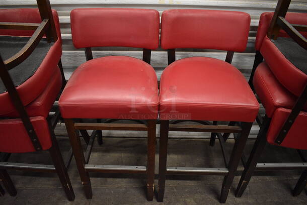 2 Wooden Bar Height Stools w/ Red Back Rest and Seat Cushion. Stock Picture - Cosmetic Condition May Vary. 17x17x41. 2 Times Your Bid!