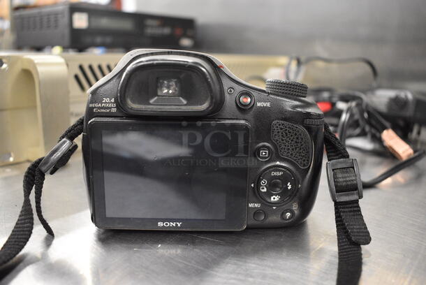 Sony DSC-HX300 Digital Camera w/ Battery and Neckstrap. 5x4x6. Does Not Power On.  - Image 4 of 7