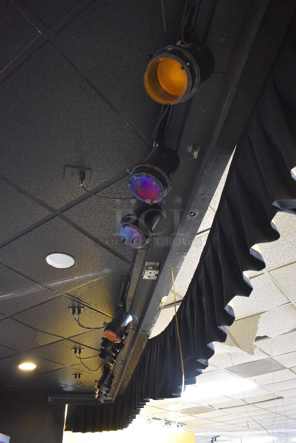 18 Black Metal Stage Lights. (12 Are Mounted To The Ceiling and 6 Are Sitting On The Stage) 6x6x12. 18 Times Your Bid! BUYER MUST REMOVE - Image 1 of 9