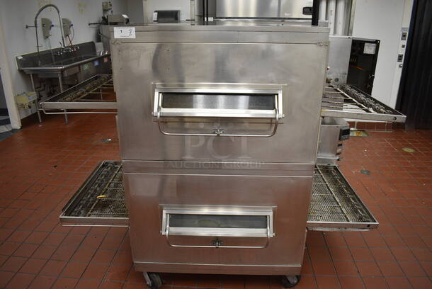 2 GORGEOUS! Stainless Steel Commercial Gas Powered Conveyor Pizza Ovens on Commercial Casters. Top Conveyor Belt Is Missing. Comes w/ 2 Gas Hoses! 79x58x64. 2 Times Your Bid! BUYER MUST REMOVE. Removal/Transport fee of $500.00 will be charged if we have to transport this item back to our warehouse for shipping or pick up