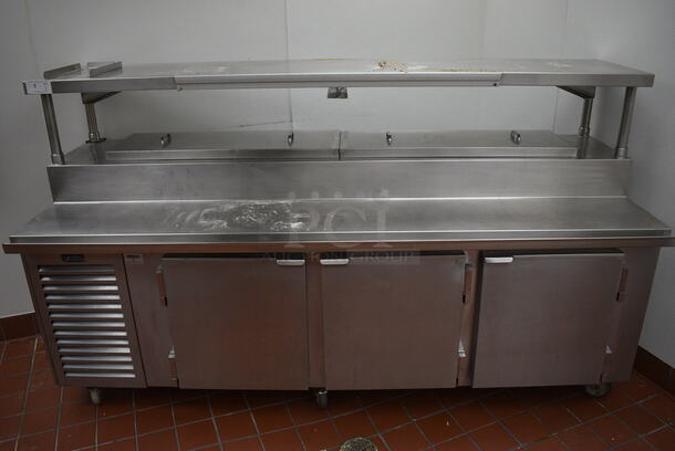 SWEET! 2007 Kairak Model KRP-96S Stainless Steel Commercial Pizza Prep Table w/ 2 Lids, 3 Doors and Overshelf on Commercial Casters. 115 Volts, 1 Phase. 96x34x56