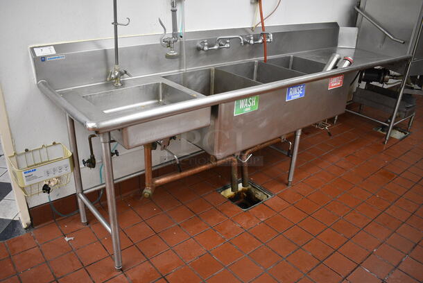 Stainless Steel Commercial 4 Bay Sink w/ Right Side Drainboard, Faucets and Spray Nozzle Attachment. 120x30x44. Bays: 20x20x5, 18x24x14. Drainboard 37x27x2. BUYER MUST REMOVE