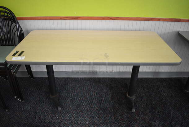 Table on 2 Black Metal Straight Leg Table Bases. 60x30x30