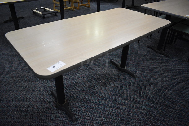 Table on 2 Black Metal Straight Leg Table Bases. 60x30x30