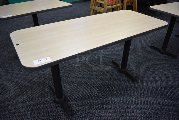 Table on 2 Black Metal Straight Leg Table Bases. 60x26x30