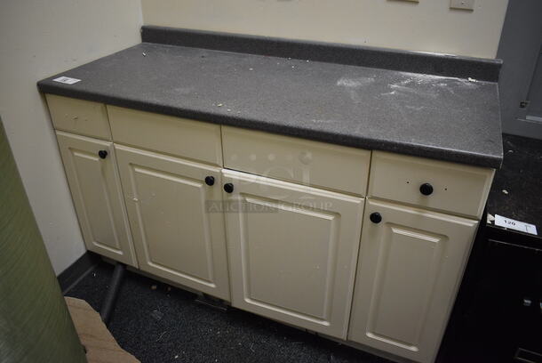 White Counter w/ Gray Countertop and 4 Doors. Includes Contents! 60.5x25.5x39. BUYER MUST REMOVE