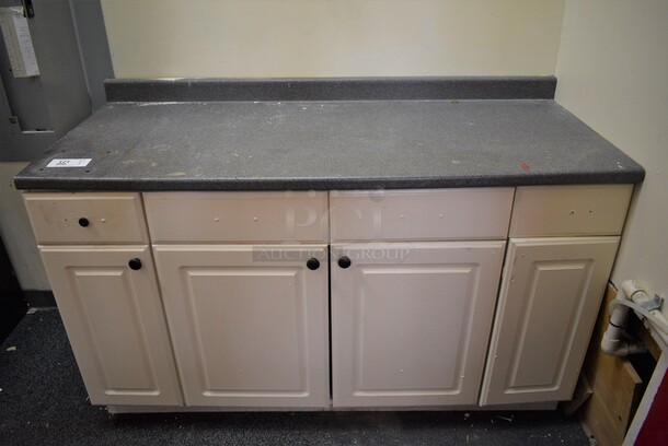 White Counter w/ Gray Countertop and 4 Doors. Includes Contents! 60.5x25.5x39. BUYER MUST REMOVE - Image 1 of 7