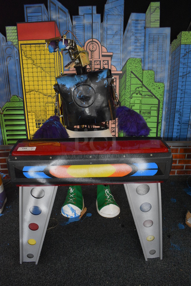Metal Animatronic Band Member w/ Green Shoes, 2 Purple Hands and Fake Piano. 24x32x64, 40x20x38. BUYER MUST REMOVE