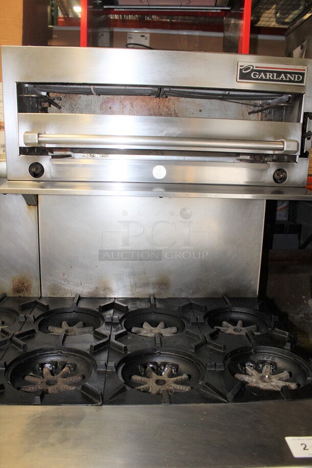 AMAZING! Garland Model M43RC Commercial Stainless Steel Natural Gas 10 Burner Range With Double Ovens (1 CONVECTION), And Salamander/Broiler/Cheese Melter  On Commercial Casters. 68x34x68  - Image 2 of 11
