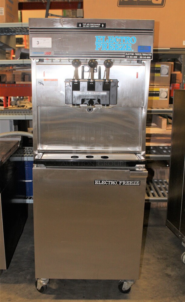 WOW WOW WOW! Electro Freeze Model 30T-RMT-232 Commercial Stainless Steel Air Cooled  Two Flavor Plus Twist Soft Serve Ice Cream/Custard/Frozen Yogurt Machine On Commercial Casters. 26x38.5x68. 208-230V. 3 Phase. Working When Pulled!  - Image 1 of 8