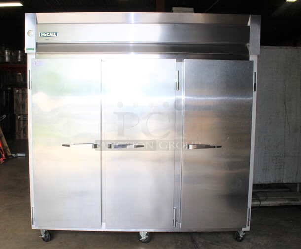 SUPER FIND! McCall Model 7-7070T Commercial Stainless Steel Triple Solid Door Reach In Refrigerator/Cooler On Commercial Casters. 83x34x84. 115V/60Hz. 1 Phase. Working When Pulled!