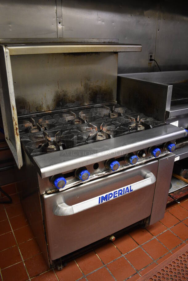 BEAUTIFUL! Imperial Stainless Steel Commercial Propane Gas Powered 6 Burner Range w/ Lower Oven and Overshelf on Commercial Casters. This Unit Will Be Professionally Uninstalled. 36x32x57. Tested and Working! - Image 2 of 6