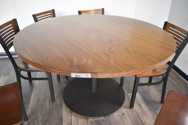 Wood Pattern Round Table on Black Metal Table Base. Stock Picture - Cosmetic Condition May Vary. 53.5x53.5x30