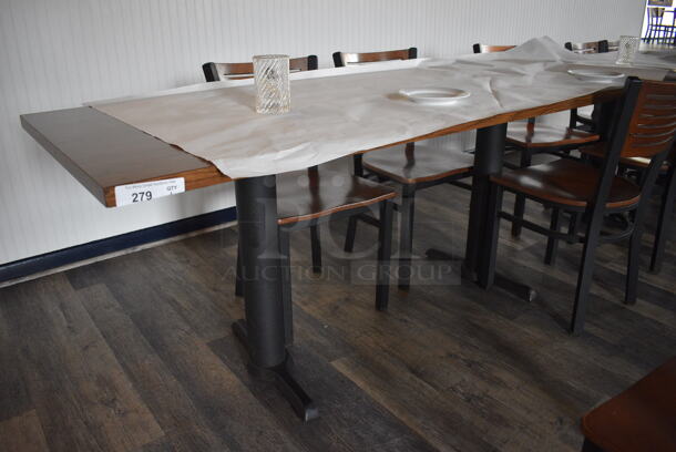 Wood Pattern Table on 2 Black Metal Table Bases. Stock Picture - Cosmetic Condition May Vary. 72x30x30
