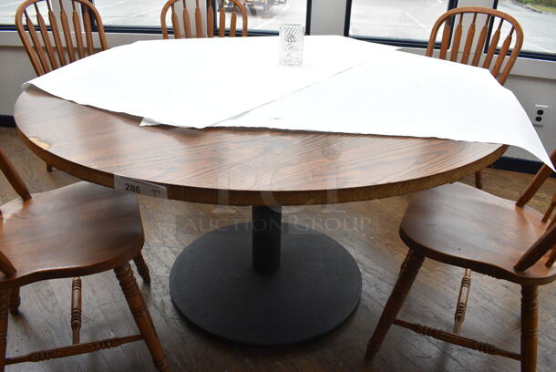 Wood Pattern Round Table on Black Metal Table Base. Stock Picture - Cosmetic Condition May Vary. 53.5x53.5x30