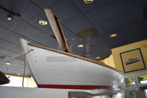 White Decorative Boat w/ 2 Oars. BUYER MUST REMOVE. 137"