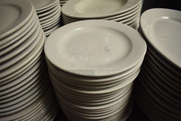 24 White Ceramic Round Plates. 9x9x1. 24 Times Your Bid!
