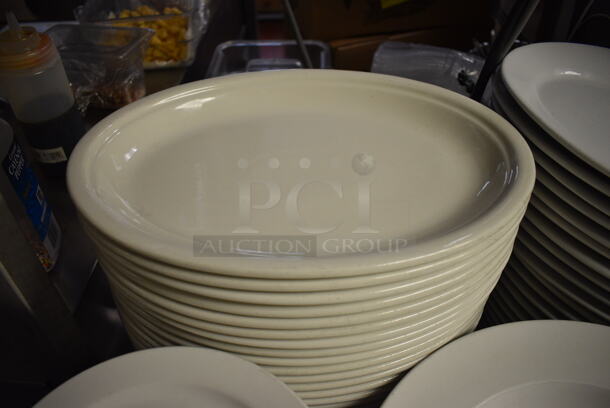 26 White Ceramic Oval Plates. 14x10.5x1.5. 26 Times Your Bid! - Image 1 of 3