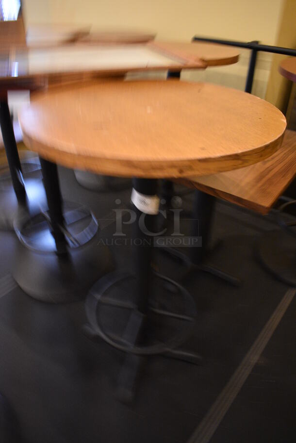 Round Wood Pattern Bar Height Table on Black Metal Table Base w/ Footrest. Stock Picture - Cosmetic Condition May Vary. 27x27x42