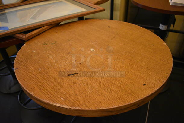 Round Wood Pattern Bar Height Table on Black Metal Table Base w/ Footrest. Stock Picture - Cosmetic Condition May Vary. 27x27x42 - Image 2 of 3
