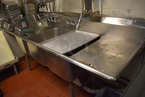Stainless Steel Commercial 3 Bay Sink w/ Dual Drainboards, Faucet, Handles and Spray Nozzle Attachment. Does Not Include Contents. This Unit Will Be Professionally Uninstalled. 98x30x46. Bays 18x24x14. Drainboards 18x20x2