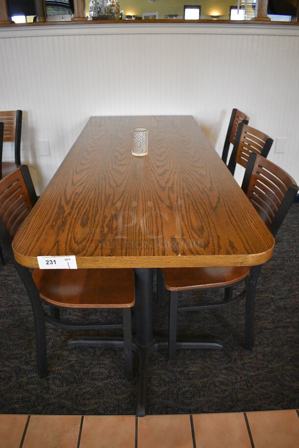 Wood Pattern Table on 2 Black Metal Table Bases. Stock Picture - Cosmetic Condition May Vary. 76x30x30