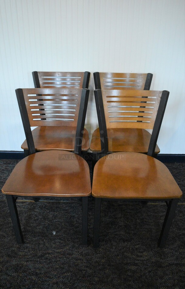 4 Black Metal Dining Chairs w/ Wooden Seat and Back Rest. Stock Picture - Cosmetic Condition May Vary. 17.5x16x32. 4 Times Your Bid!