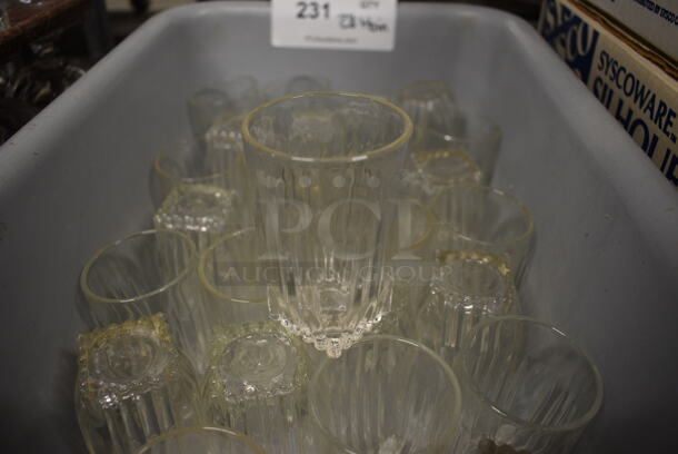 28 Beverage Glasses in Gray Bin. 2x2x3.5. 28 Times Your Bid!