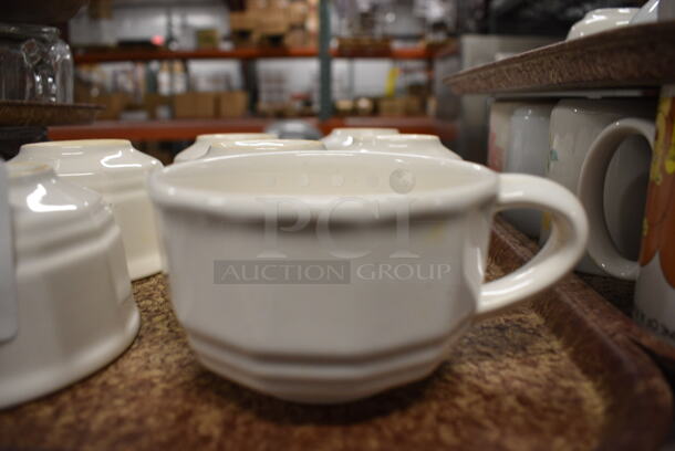 7 White Ceramic Mugs on Brown Tray. 5x4x2.5. 7 Times Your Bid! - Image 1 of 3