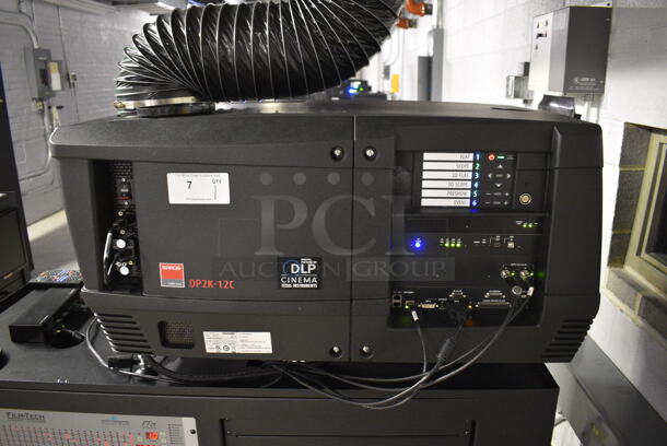 MARVELOUS! 2014 Barco Model DP2K-12C Commercial Countertop DLP Cinema Projector on Cabinet w/ Film-Tech FT21 Automation Cinema System, Gefer Cinema Scaler Pro III, Dolby CP750 Digital Cinema Processor, DCM Powercom, TV Monitor and Tripp Lite Surge Protector. 200-240 Volts. See Lot 8 For Additional Pictures! 26x38x22, 24x53x38. BUYER MUST REMOVE. Tested and Working! - Image 2 of 12
