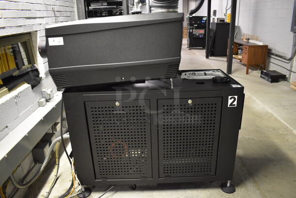 MARVELOUS! 2014 Barco Model DP2K-12C Commercial Countertop DLP Cinema Projector on Cabinet w/ Film-Tech FT21 Automation Cinema System, Gefer Cinema Scaler Pro III, Dolby CP750 Digital Cinema Processor, DCM Powercom, TV Monitor and Tripp Lite Surge Protector. 200-240 Volts. See Lot 10 For Additional Pictures! 26x38x22, 24x53x38. BUYER MUST REMOVE. Tested and Working! - Image 2 of 12