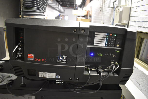 MARVELOUS! 2014 Barco Model DP2K-12C Commercial Countertop DLP Cinema Projector on Cabinet w/ Film-Tech FT21 Automation Cinema System, Gefer Cinema Scaler Pro III, Dolby CP750 Digital Cinema Processor, DCM Powercom, TV Monitor and Tripp Lite Surge Protector. 200-240 Volts. See Lot 10 For Additional Pictures! 26x38x22, 24x53x38. BUYER MUST REMOVE. Tested and Working! - Image 3 of 12
