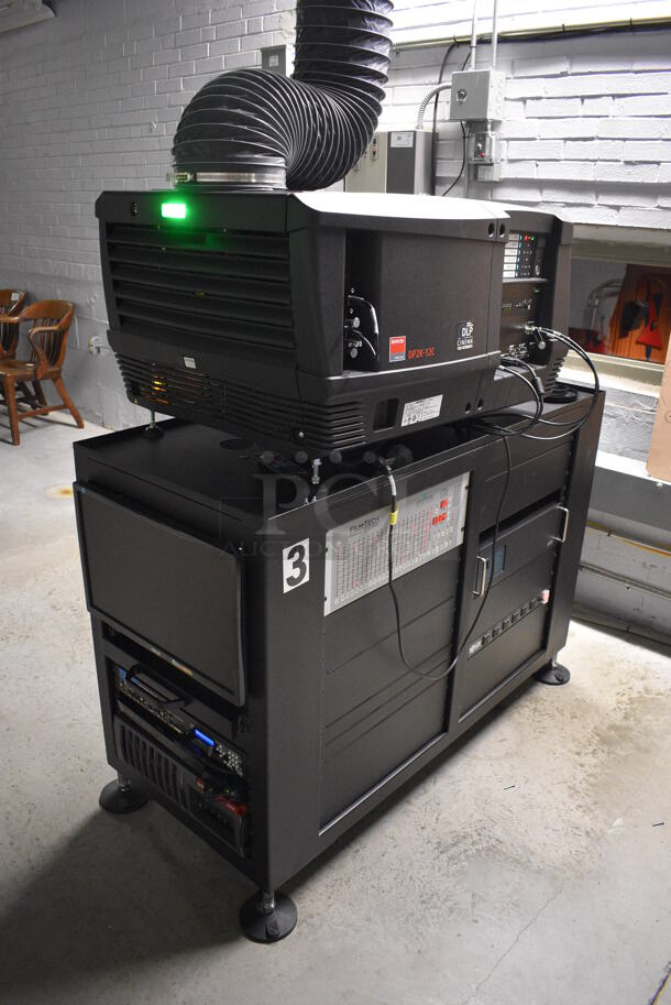 MARVELOUS! 2014 Barco Model DP2K-12C Commercial Countertop DLP Cinema Projector on Cabinet w/ Film-Tech FT21 Automation Cinema System, Gefer Cinema Scaler Pro III, Dolby CP750 Digital Cinema Processor, DCM Powercom, TV Monitor and Tripp Lite Surge Protector. 200-240 Volts. See Lot 12 For Additional Pictures! 26x38x22, 24x53x38. BUYER MUST REMOVE. Tested and Working! - Image 2 of 12