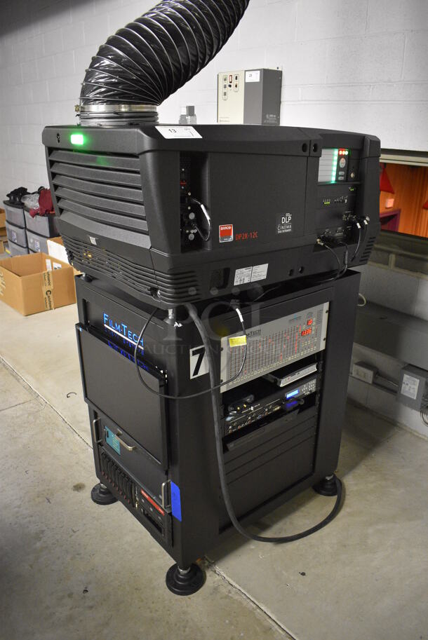 MARVELOUS! 2015 Barco Model DP2K-12C Commercial Countertop DLP Cinema Projector on Cabinet w/ Film-Tech FT21 Automation Cinema System, Gefer Cinema Scaler Pro III, Dolby CP750 Digital Cinema Processor, DCM Powercom, TV Monitor and Tripp Lite Surge Protector. 200-240 Volts. See Lot 14 For Additional Pictures! 26x38x22, 24x53x38. BUYER MUST REMOVE. Tested and Working! - Image 2 of 12