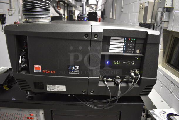 MARVELOUS! 2014 Barco Model DP2K-12C Commercial Countertop DLP Cinema Projector on Cabinet w/ Film-Tech FT21 Automation Cinema System, Gefer Cinema Scaler Pro III, Dolby CP750 Digital Cinema Processor, DCM Powercom, TV Monitor and Tripp Lite Surge Protector. 200-240 Volts. See Lot 16 For Additional Pictures! 26x38x22, 24x53x38. BUYER MUST REMOVE. Tested and Working! - Image 2 of 12
