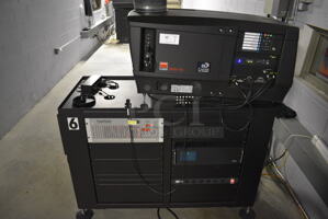 MARVELOUS! 2014 Barco Model DP2K-12C Commercial Countertop DLP Cinema Projector on Cabinet w/ Film-Tech FT21 Automation Cinema System, Gefer Cinema Scaler Pro III, Dolby CP750 Digital Cinema Processor, DCM Powercom, TV Monitor and Tripp Lite Surge Protector. 200-240 Volts. See Lot 18 For Additional Pictures! 26x38x22, 24x53x38. BUYER MUST REMOVE. Tested and Working!