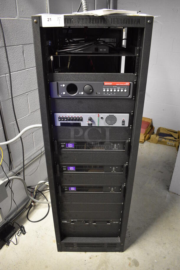 7 FANTASTIC! Items In Black Metal Rack Unit; Inline CTL101 Central Interface, Dolby CP750 Digital Cinema Processor, CM Series , 3 QSC BCA1622 Digital Cinema Amplifiers and Component Engineering LS-30-M. 22.5x22x69. 7 Times Your Bid!