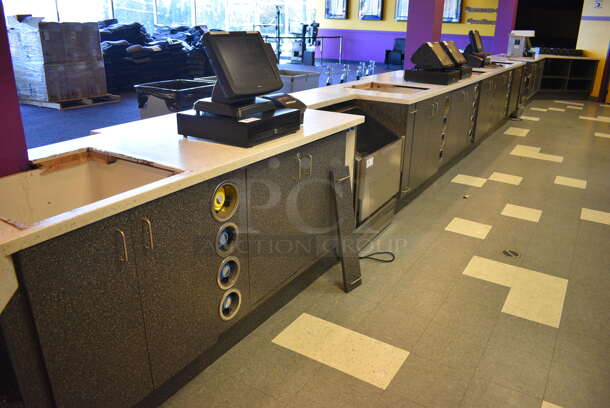 Serving Counter w/ Gray Doors, White Countertop and 16 Rear In Counter Cup Dispensers. Approximately 450