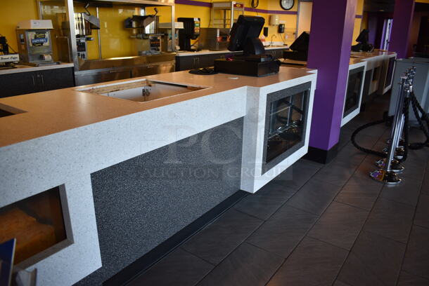 Serving Counter w/ Gray Doors, White Countertop and 16 Rear In Counter Cup Dispensers. Approximately 450" Wide See Picture For Dimensions. BUYER MUST REMOVE - Image 8 of 10