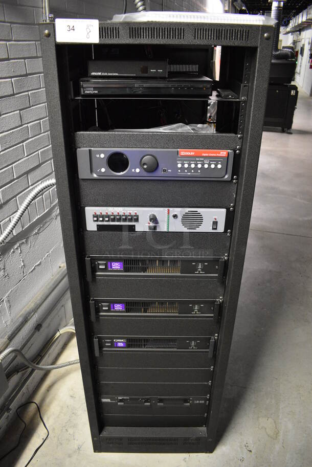 8 FANTASTIC! Items In Black Metal Rack Unit; Inline CTL101 Central Interface, Memorex Unit, Dolby CP750 Digital Cinema Processor, CM Series, 3 QSC BCA1622 Digital Cinema Amplifiers and Component Engineering LS-30-M. 22.5x22x69. 8 Times Your Bid!