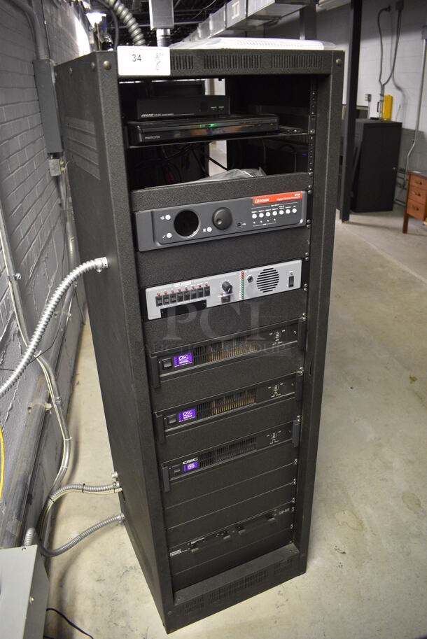 8 FANTASTIC! Items In Black Metal Rack Unit; Inline CTL101 Central Interface, Memorex Unit, Dolby CP750 Digital Cinema Processor, CM Series, 3 QSC BCA1622 Digital Cinema Amplifiers and Component Engineering LS-30-M. 22.5x22x69. 8 Times Your Bid! - Image 2 of 11