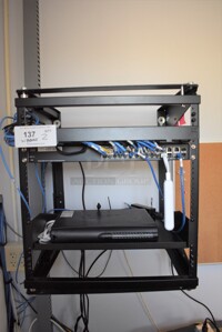 ALL ONE MONEY! Lot of Cisco SG300 28 Port Gigabit Managed Switch and Unit In Black Wall Mount Display. 20x18x24. BUYER MUST REMOVE
