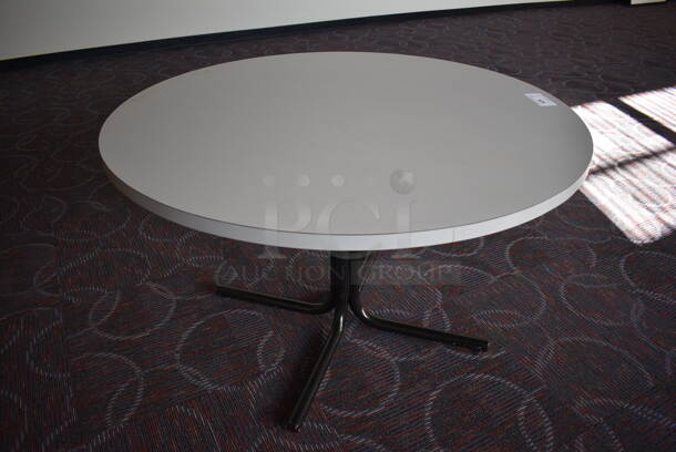 White Round Table on Metal Table Base. 47x47x29